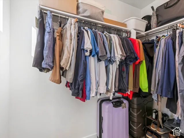 Built-in closet shelving system with multiple hanging rods