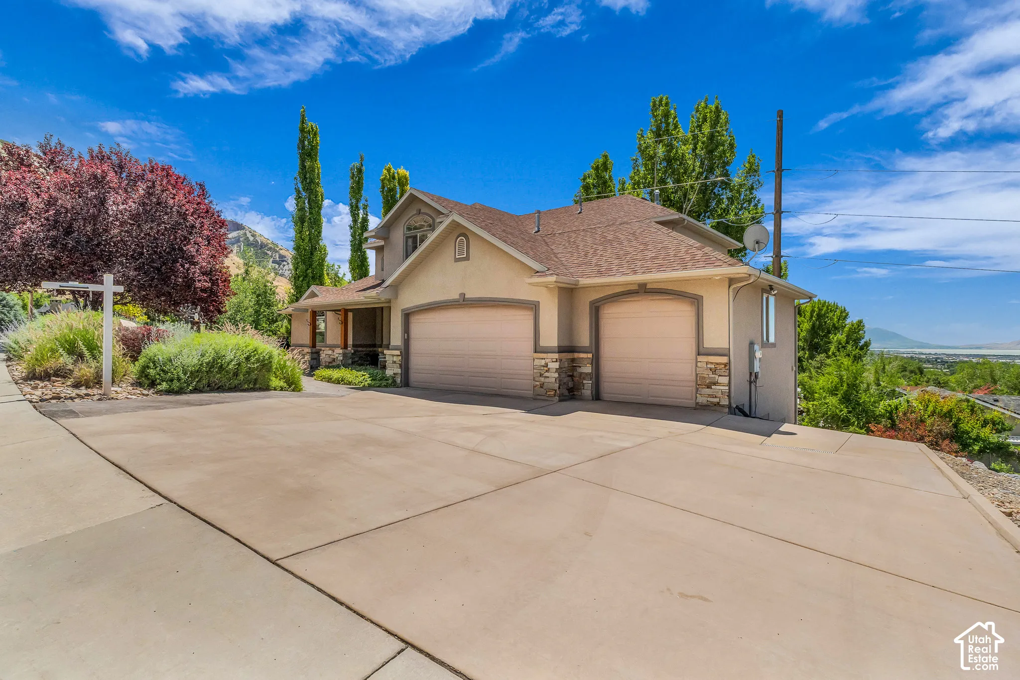 Two-story exterior with stucco finish and stone accents