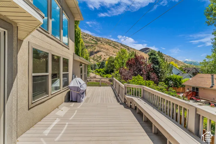 Expansive deck featuring built-in bench seating, durable composite decking, and a sturdy railing system