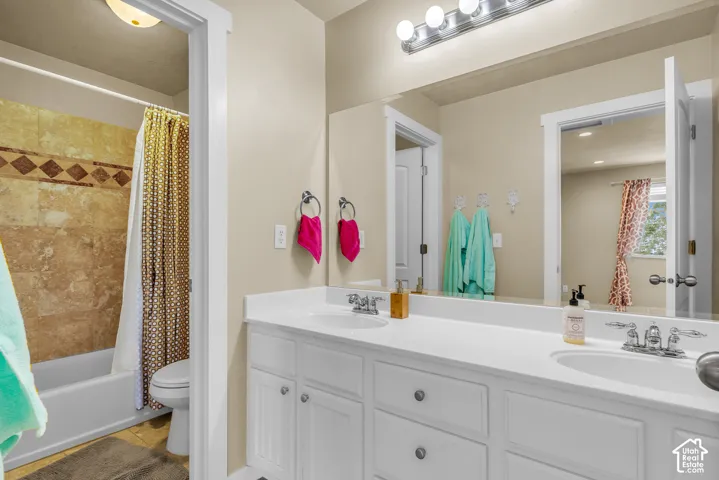 Dual vanity with white cabinetry and chrome fixtures