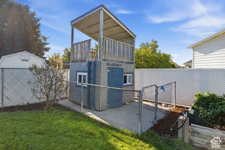 Two-story outbuilding with a ground-level room and an upper-level deck