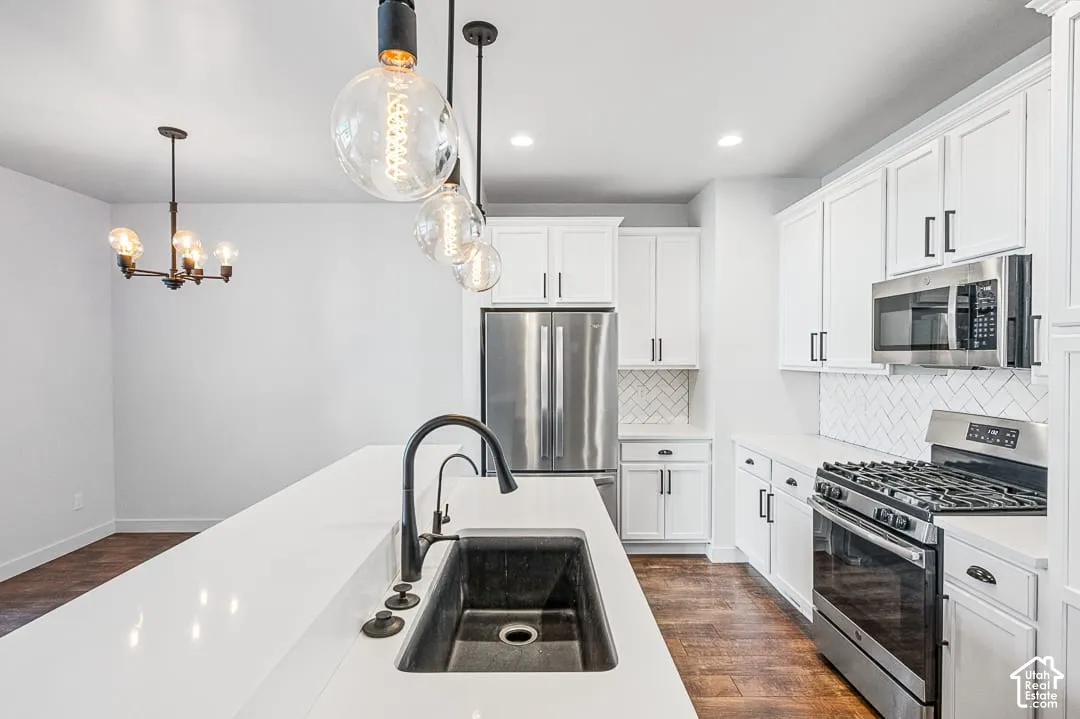 Kitchen with quartz countertops and stainless steel appliances