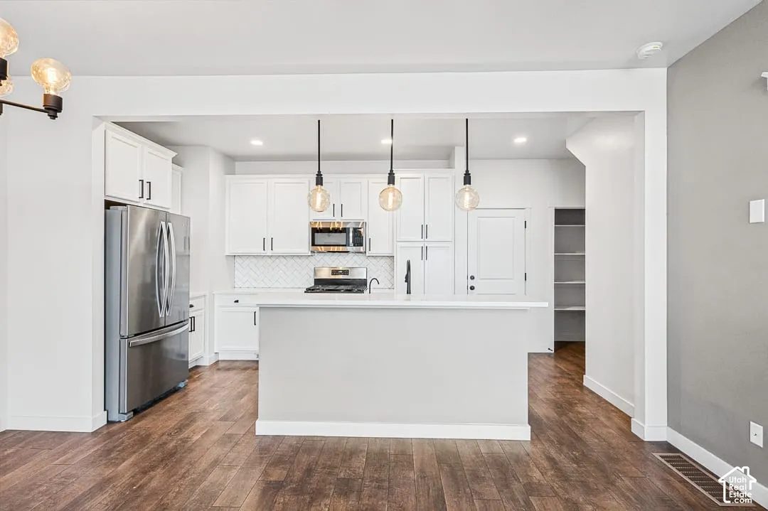 Open kitchen with stainless steel appliances & central island