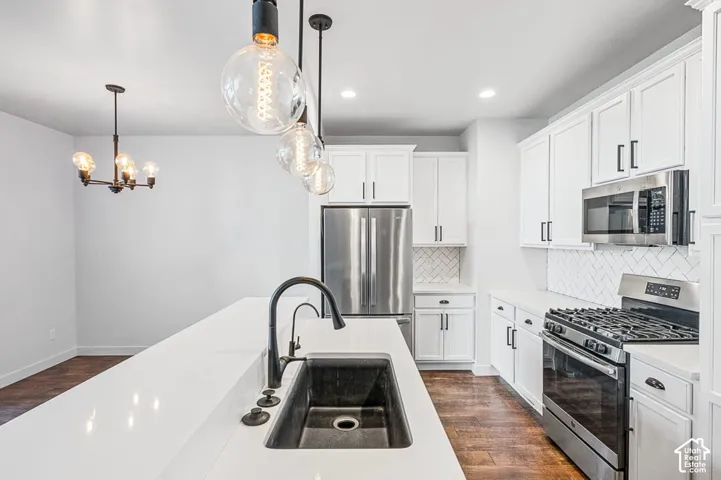 Kitchen with quartz countertops and stainless steel appliances
