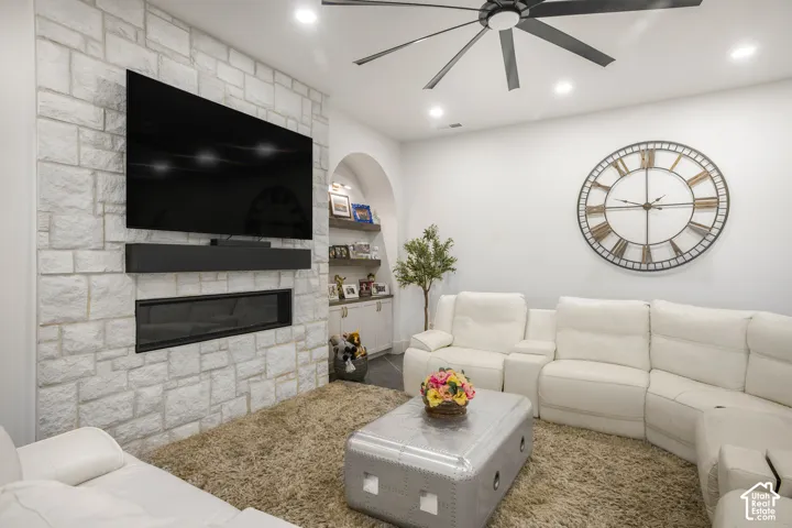 Stone-finish accent wall with a linear fireplace