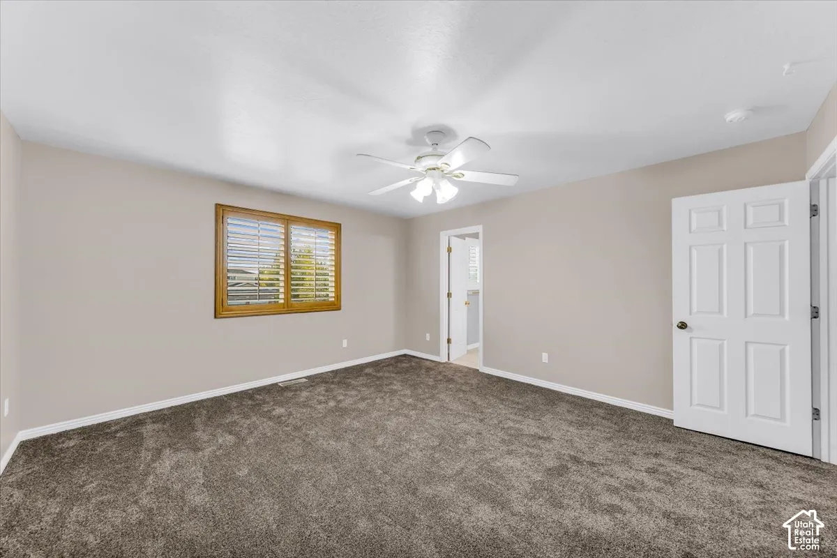 Neutral wall tones complement plush carpeting