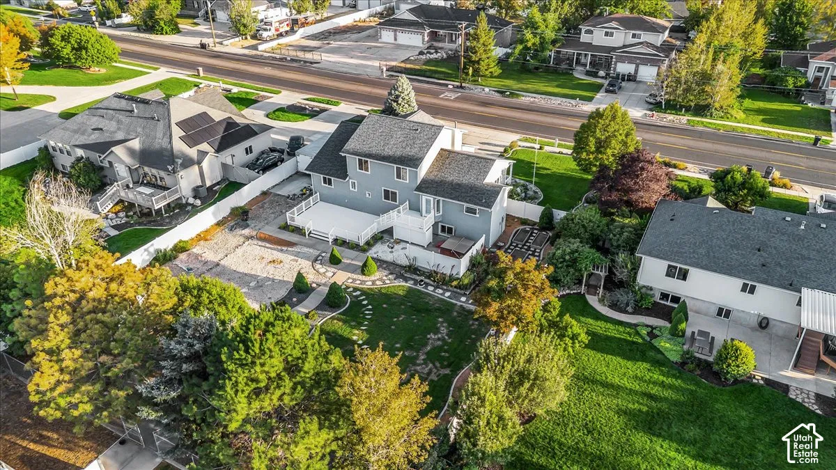 Two-story residence with a brick exterior, white trim, and a multi-level deck