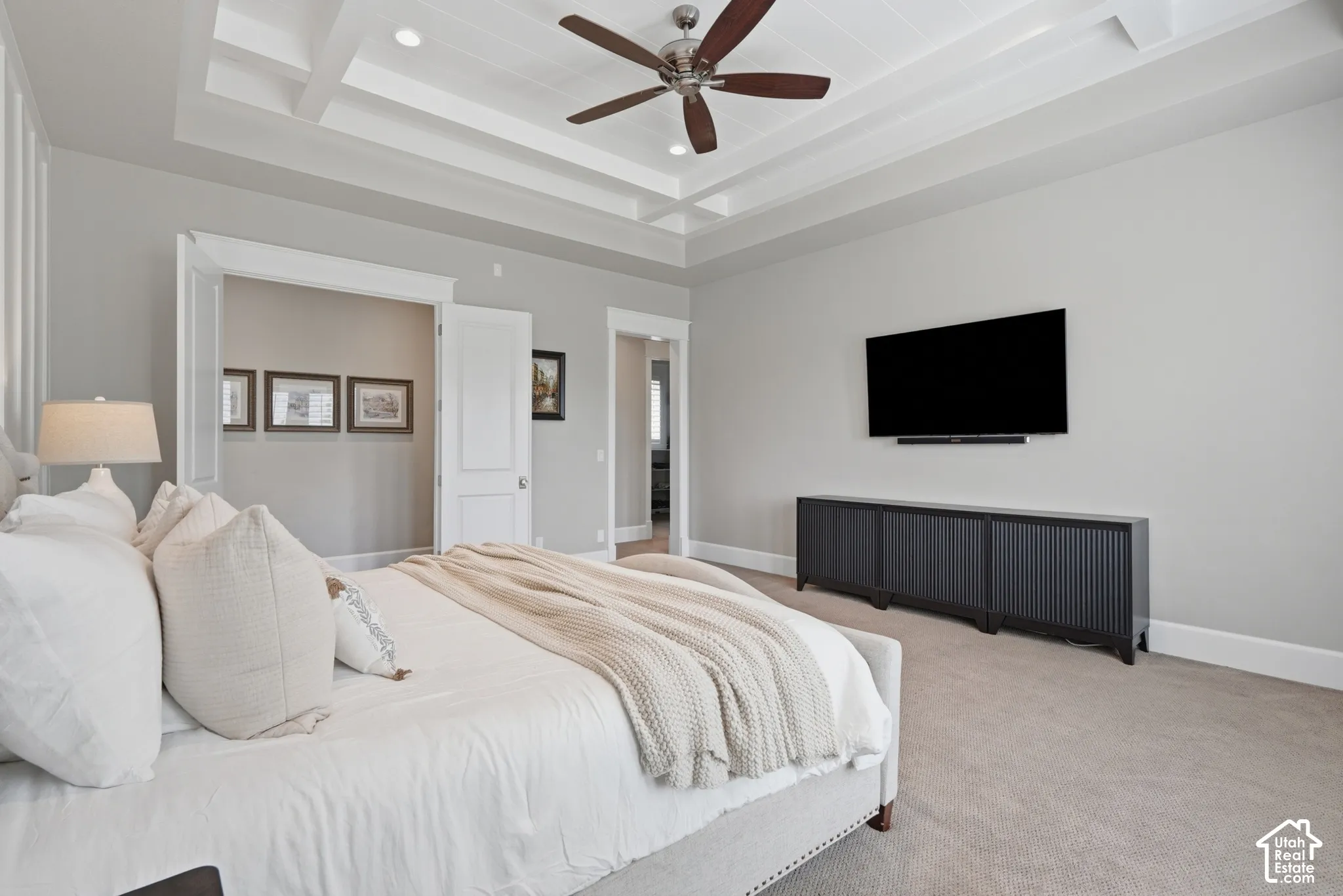 Tray ceiling with recessed lighting and a ceiling fan