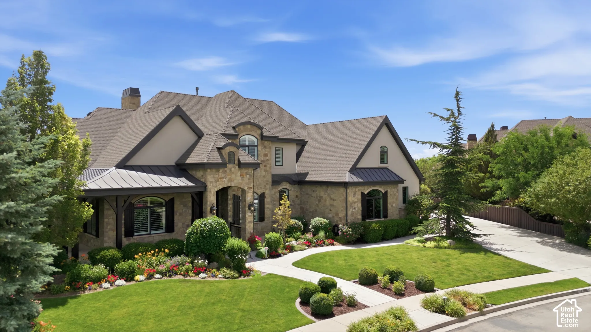 Stone and stucco exterior with multiple gables