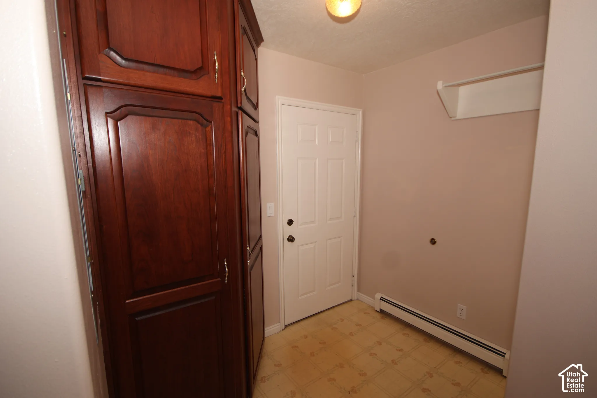 Built-in cabinetry with wood-finish panels and gold-tone hardware