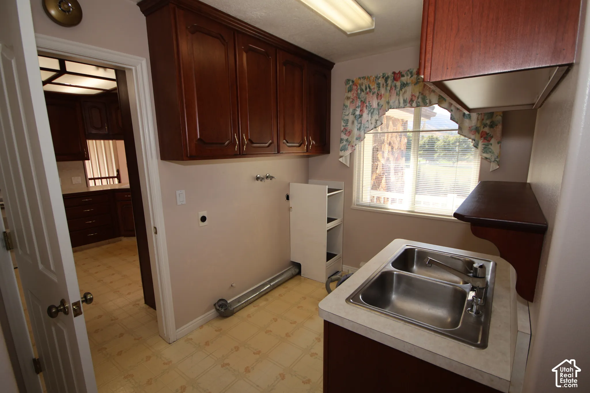 Double basin stainless steel sink with a chrome faucet