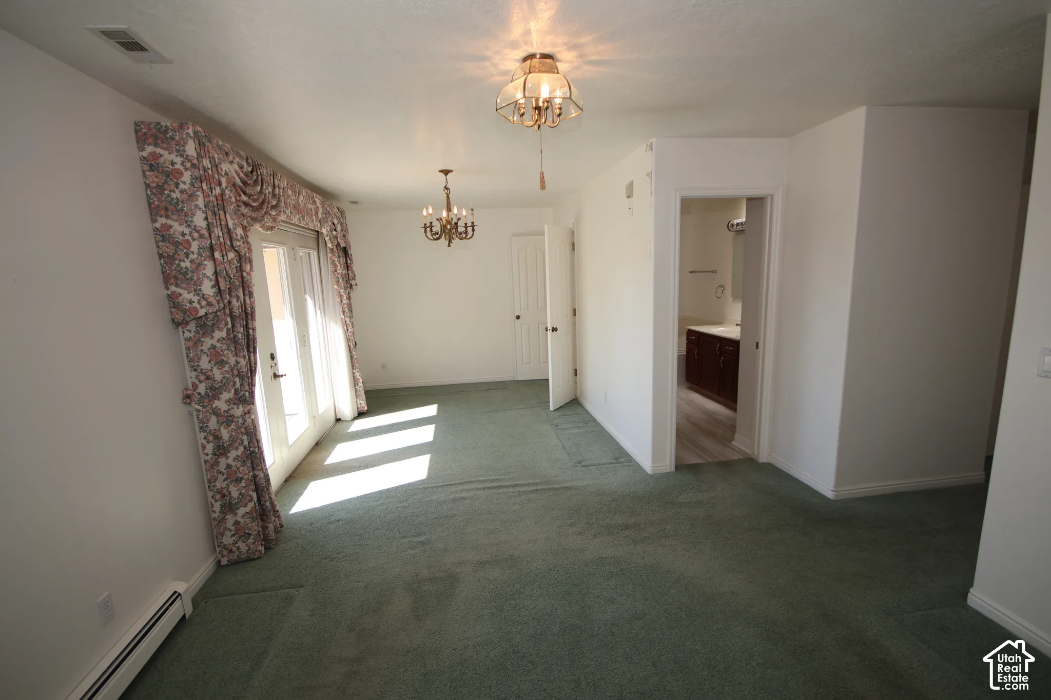 White walls with green carpeting