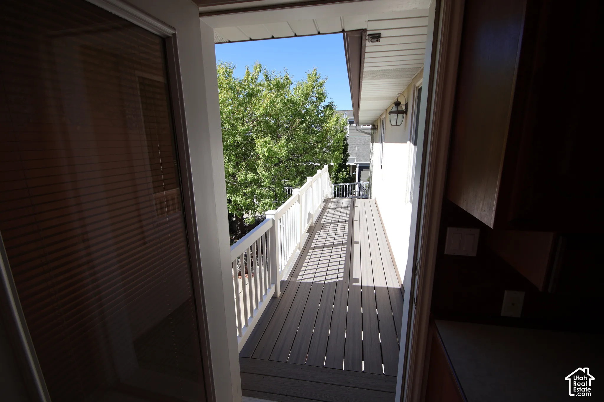 Exterior deck with composite decking and white railings