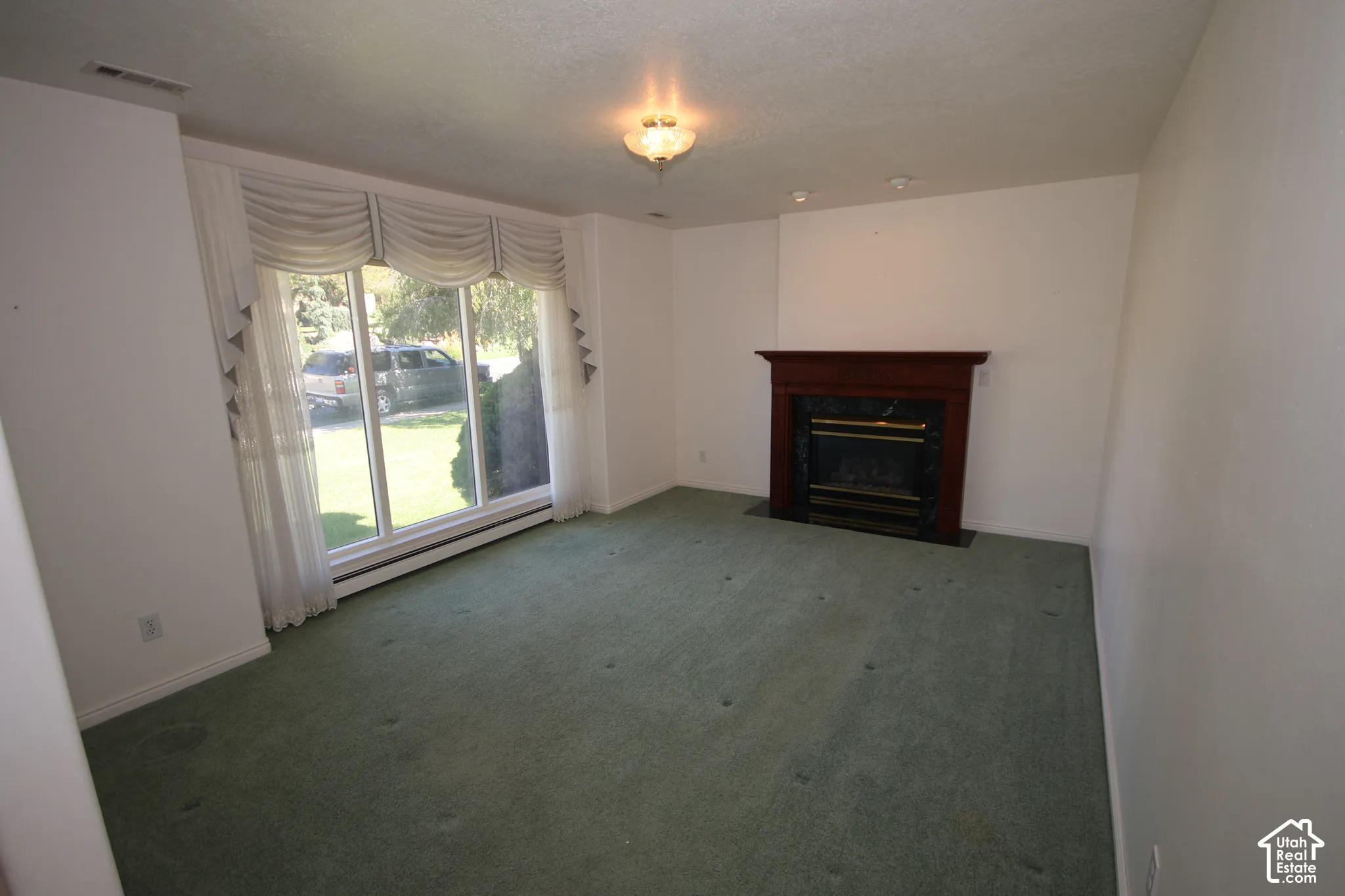 Fireplace with wood mantel and stone surround