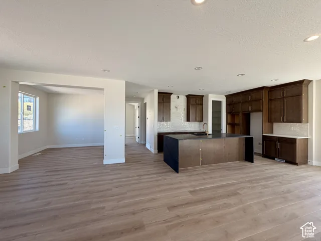 Main floor featuring a chef's kitchen and flex space