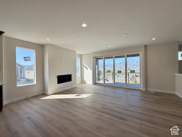 Main floor featuring a floor to ceiling fireplace and multi-panel sliding glass door