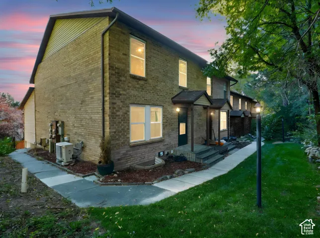 Brick exterior with architectural shingles and covered entryways