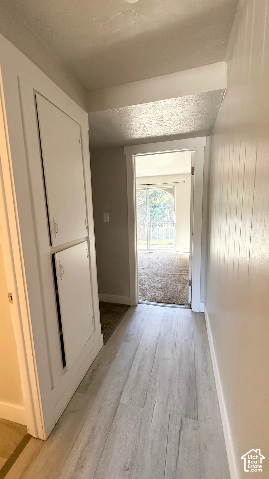 Wood-finish flooring with built-in cabinetry