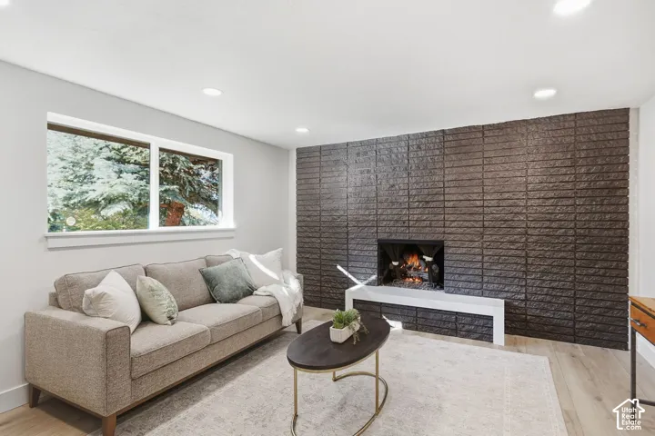 Modern fireplace featuring a dark brick surround and a light-colored hearth