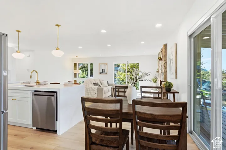 Kitchen island with a built-in sink and stainless steel dishwasher