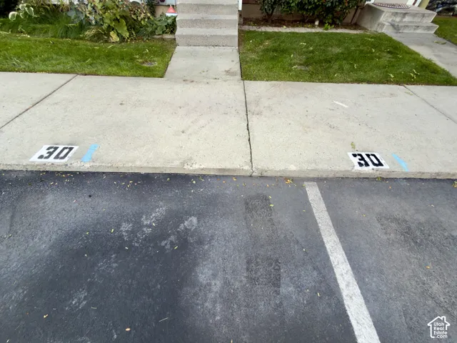 Two designated parking spots in front of the townhouse