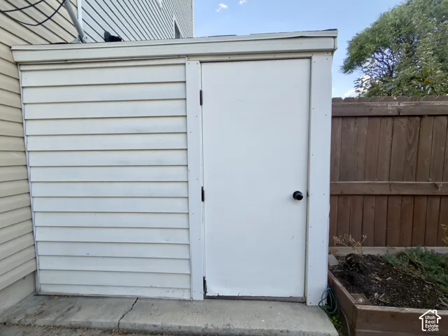 Storage shed in the fenced backyard