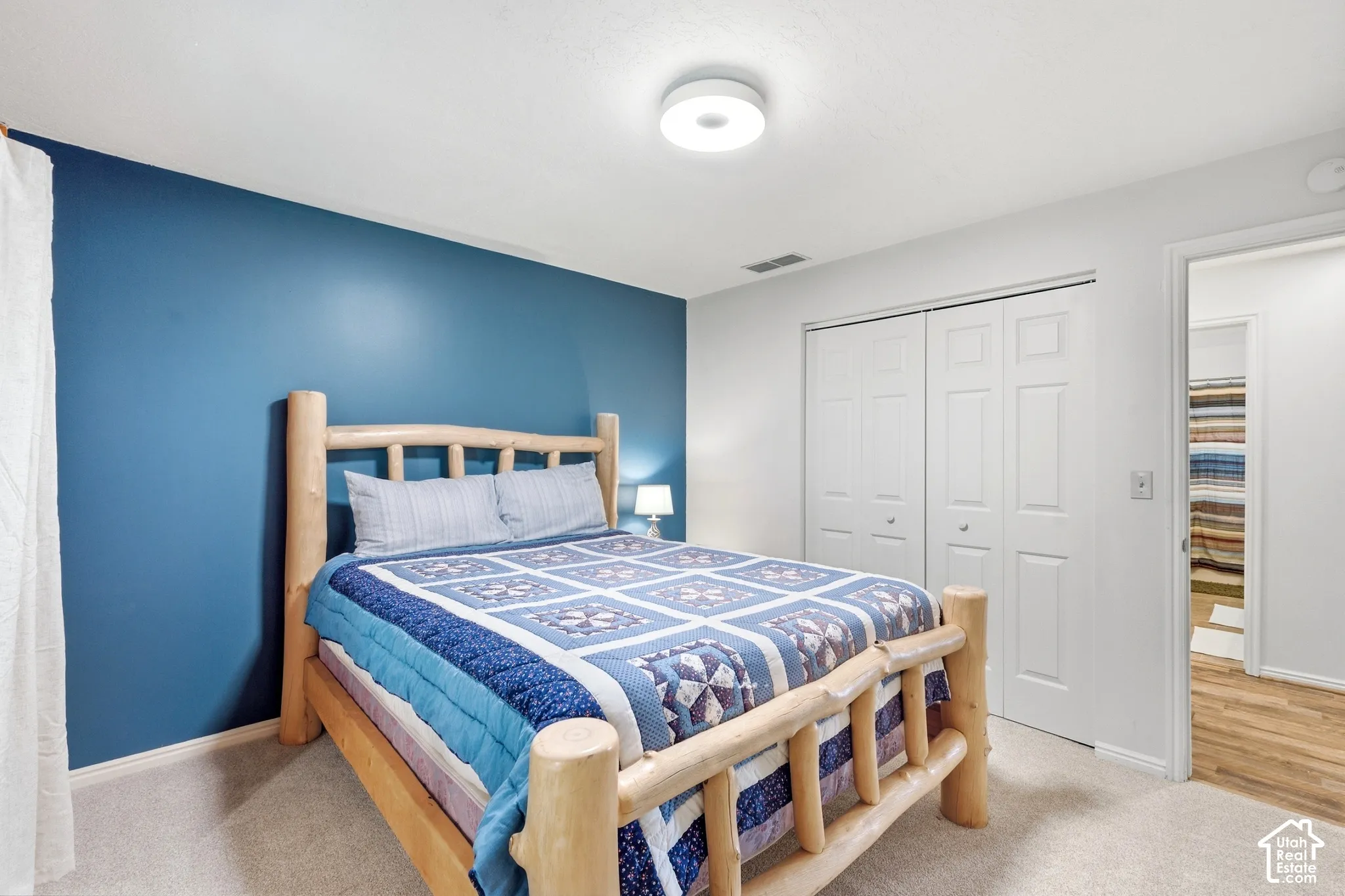 Recessed ceiling lighting, carpeted flooring, and bifold closet doors