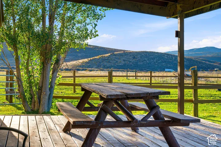 Expansive wooden deck with an open-air covered area
