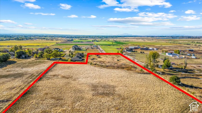 Expansive open lot with distant mountain scenery