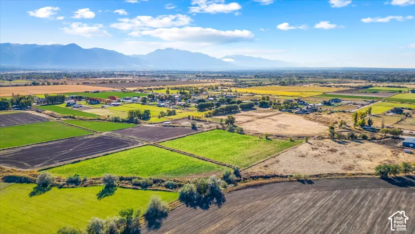 Expansive agricultural land with varied fields of crops and cultivated soil