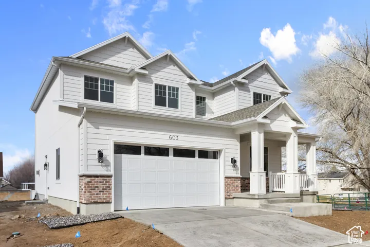 Modern exterior with white siding and brick accents
