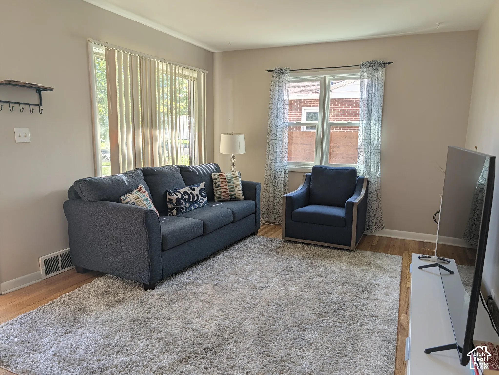 Wood-finish flooring with a neutral wall color throughout