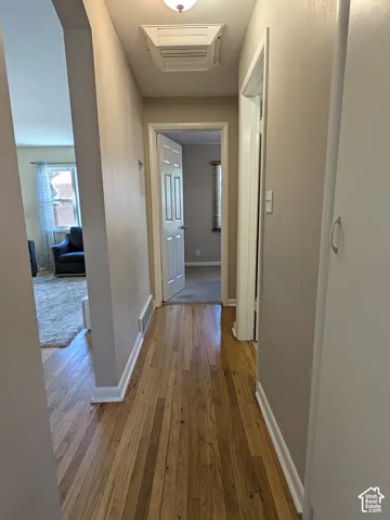 Hardwood flooring throughout the hallway
