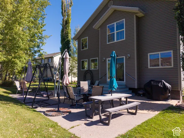 Expansive concrete patio with direct access to the residence