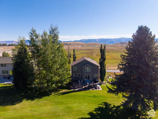 Expansive green lawn surrounding the property