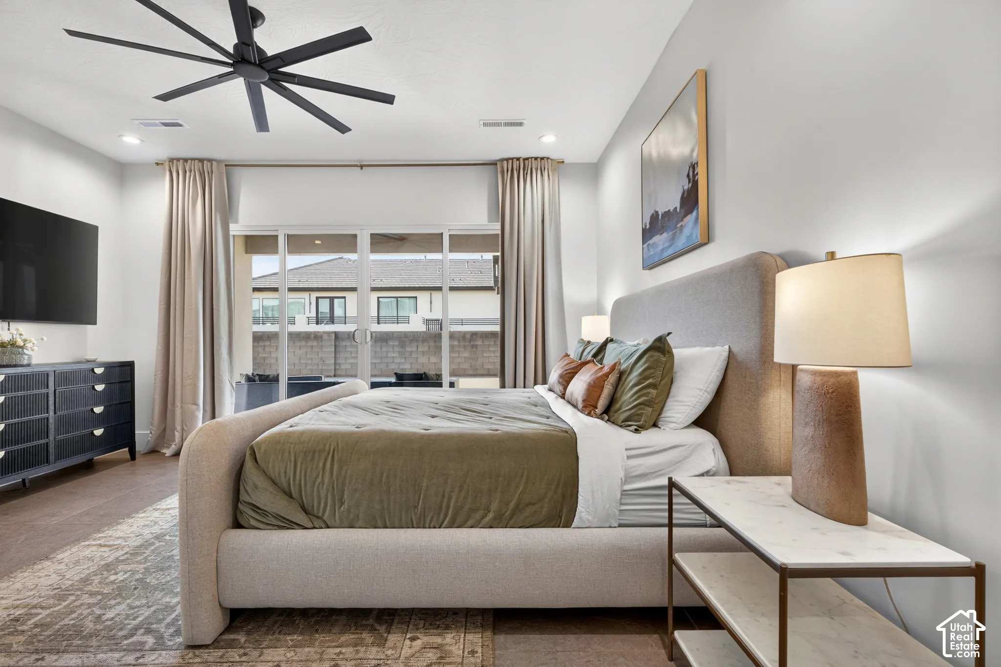 Wood-finish flooring, recessed lighting, and a modern ceiling fan