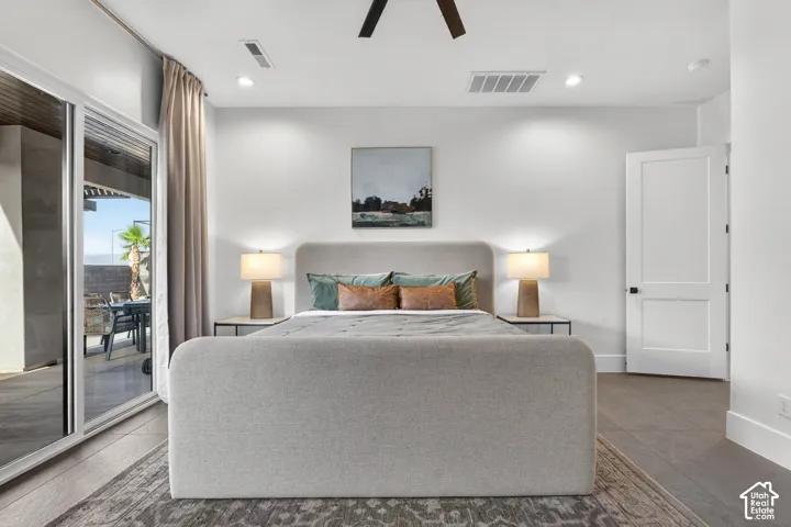 Sliding glass doors, recessed lighting, wood-finish flooring, ceiling fan, and a two-panel interior door