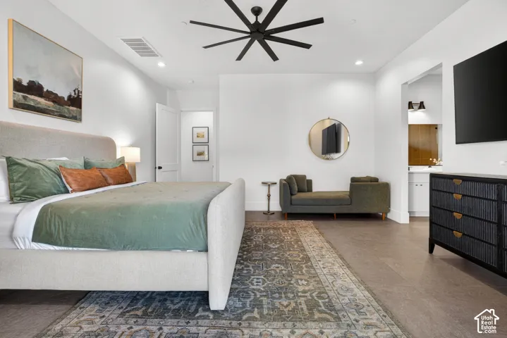 Spacious room featuring high ceilings, recessed lighting, wood-finish flooring, and a modern ceiling fan