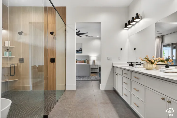Dual vanity with white cabinetry, matte black fixtures, and a glass-enclosed shower with wood-finish paneling and integrated shelving