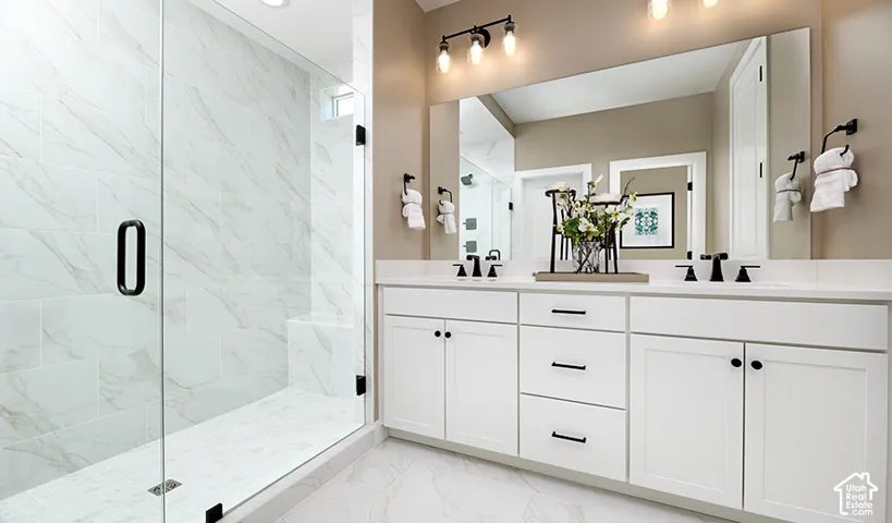 Dual vanity with white cabinetry and matte black hardware