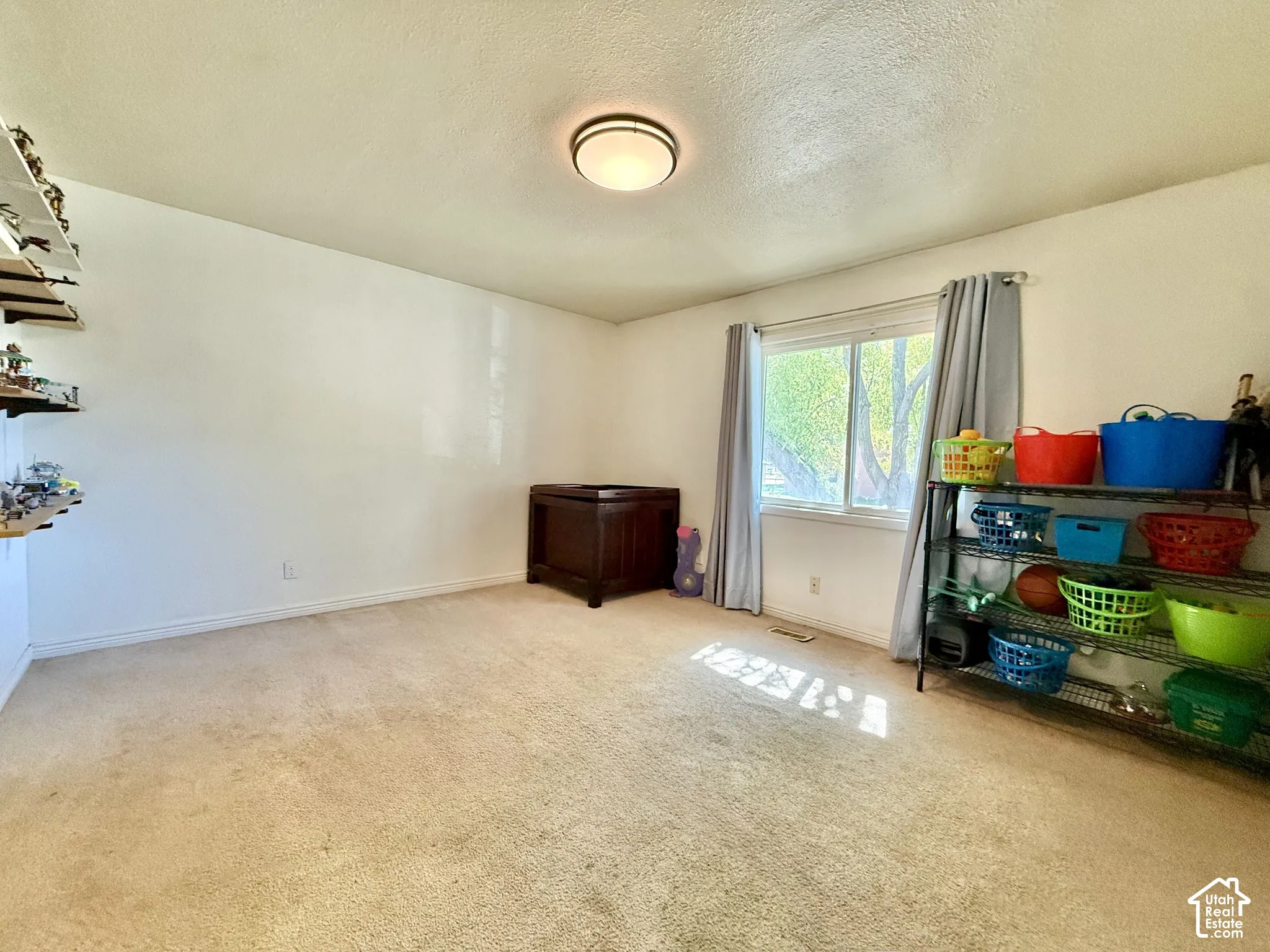 Large bedroom #1, Recessed lighting, light-colored carpeting, and a window with natural light