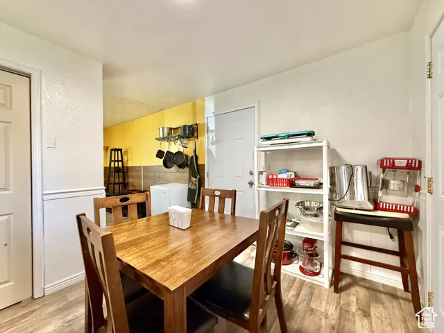 Wood-finish flooring with white wainscoting