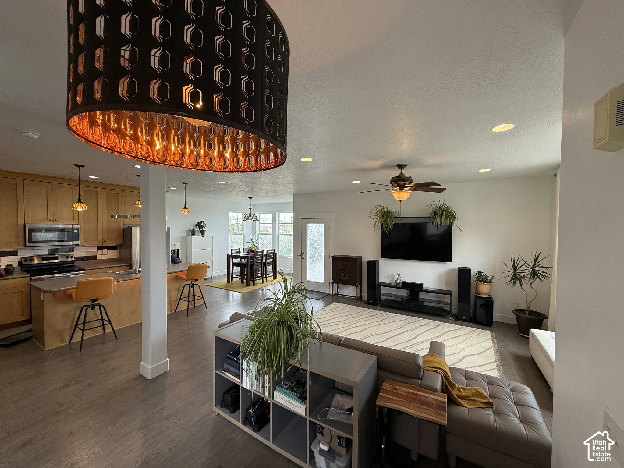 Recessed lighting, ceiling fan, and wood-finish flooring throughout