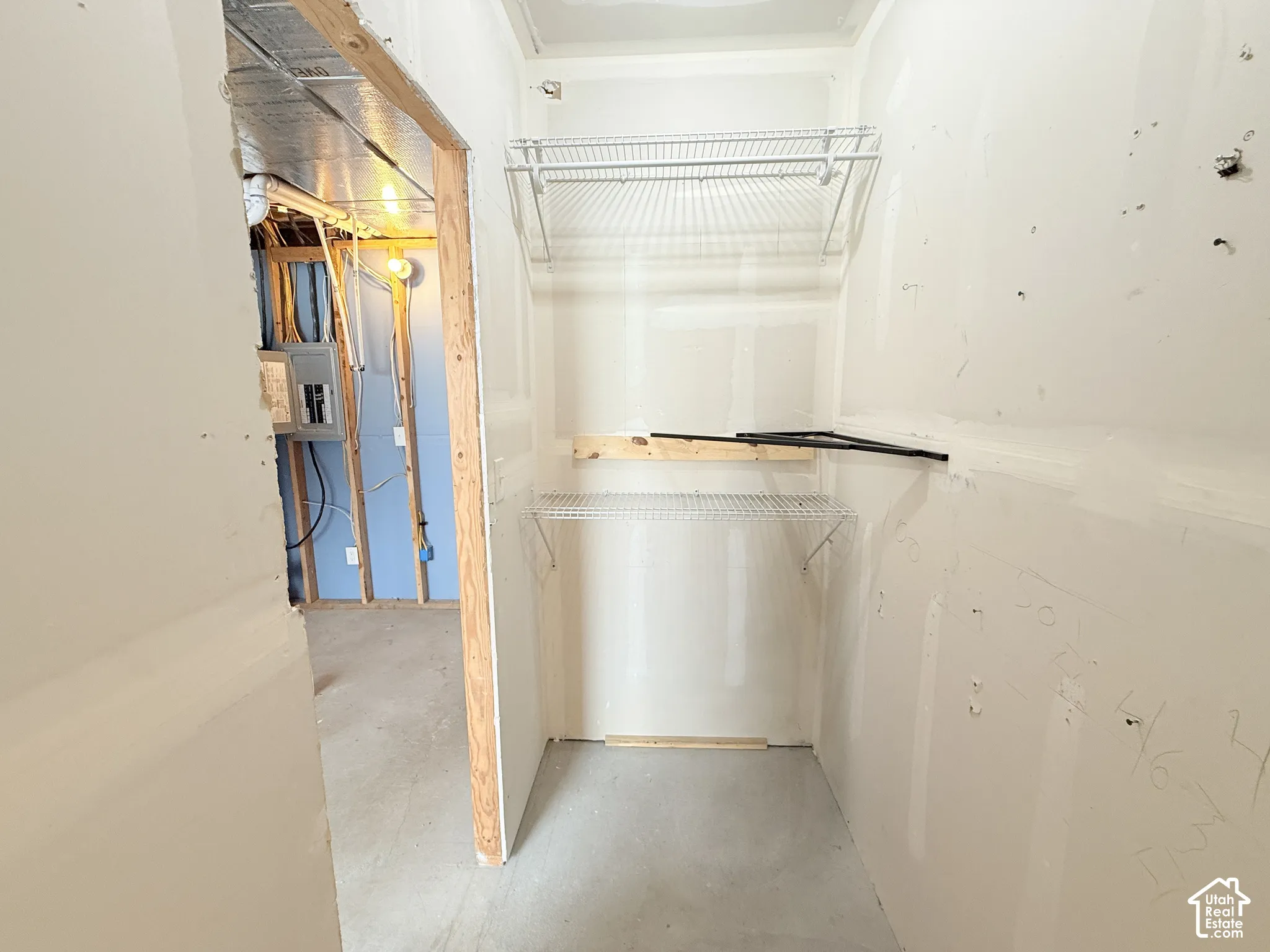 Unfinished interior space with exposed wood framing