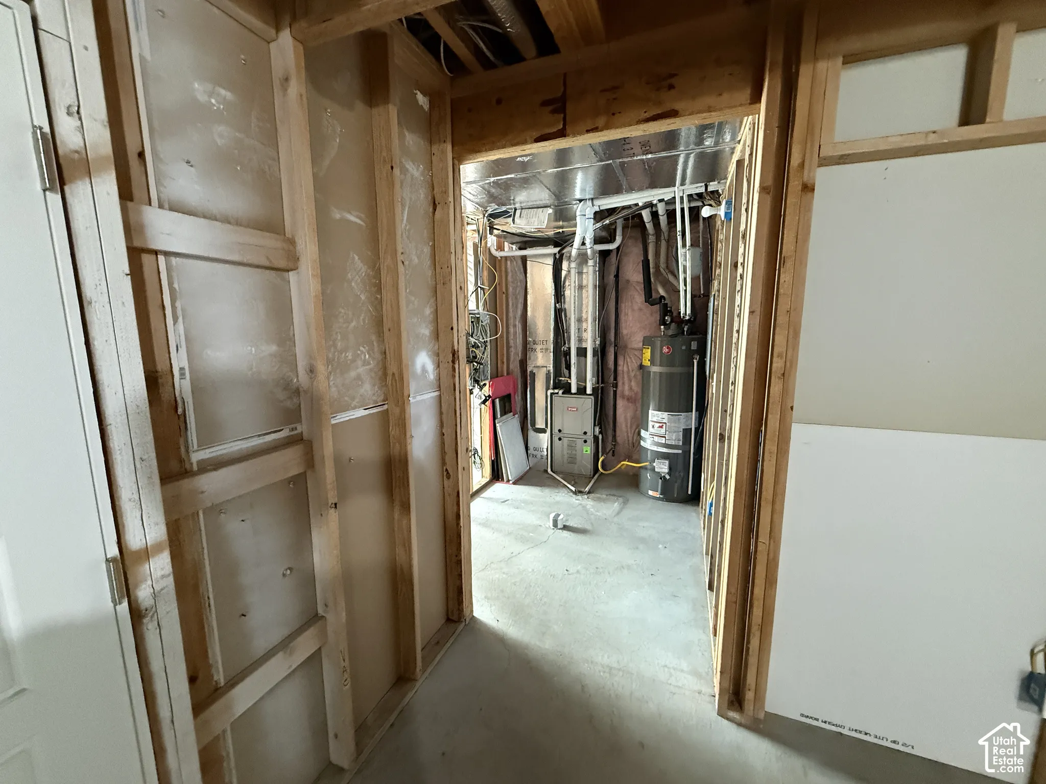 Unfinished interior space with exposed wood framing