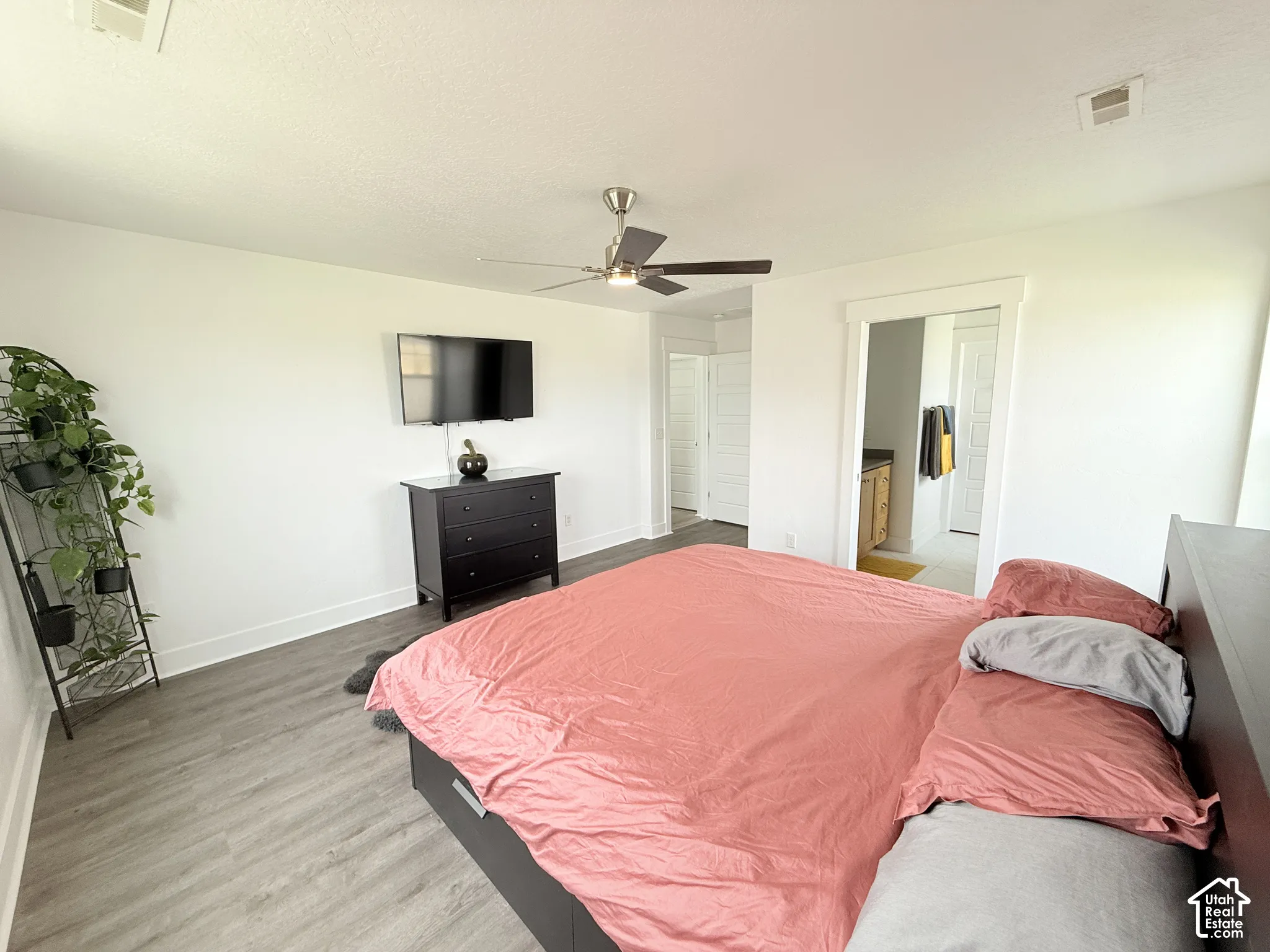 Recessed lighting, wood-finish flooring, ceiling fan, and white trim