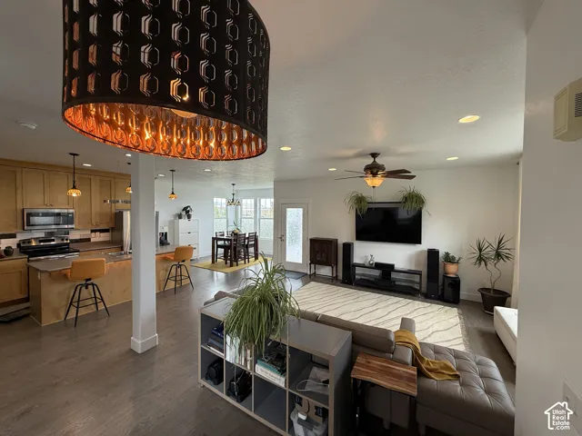 Recessed lighting, ceiling fan, and wood-finish flooring throughout