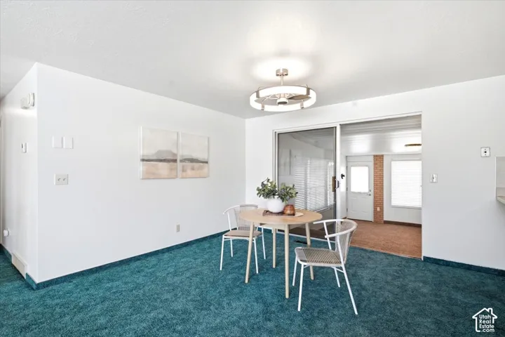 Sliding glass door leading to an additional enclosed space