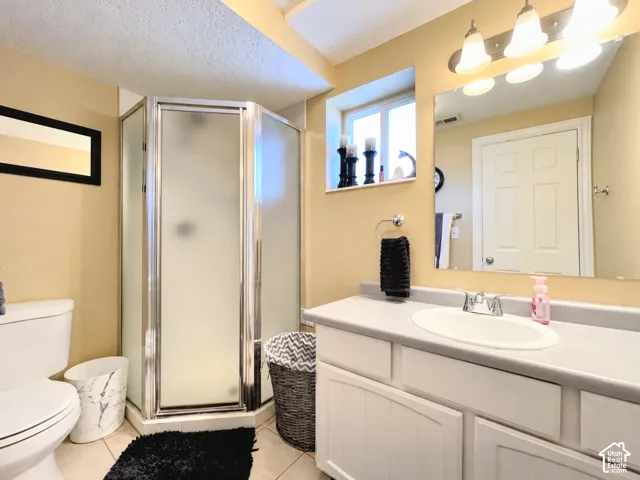 White vanity with cabinet storage, integrated sink, and chrome faucet