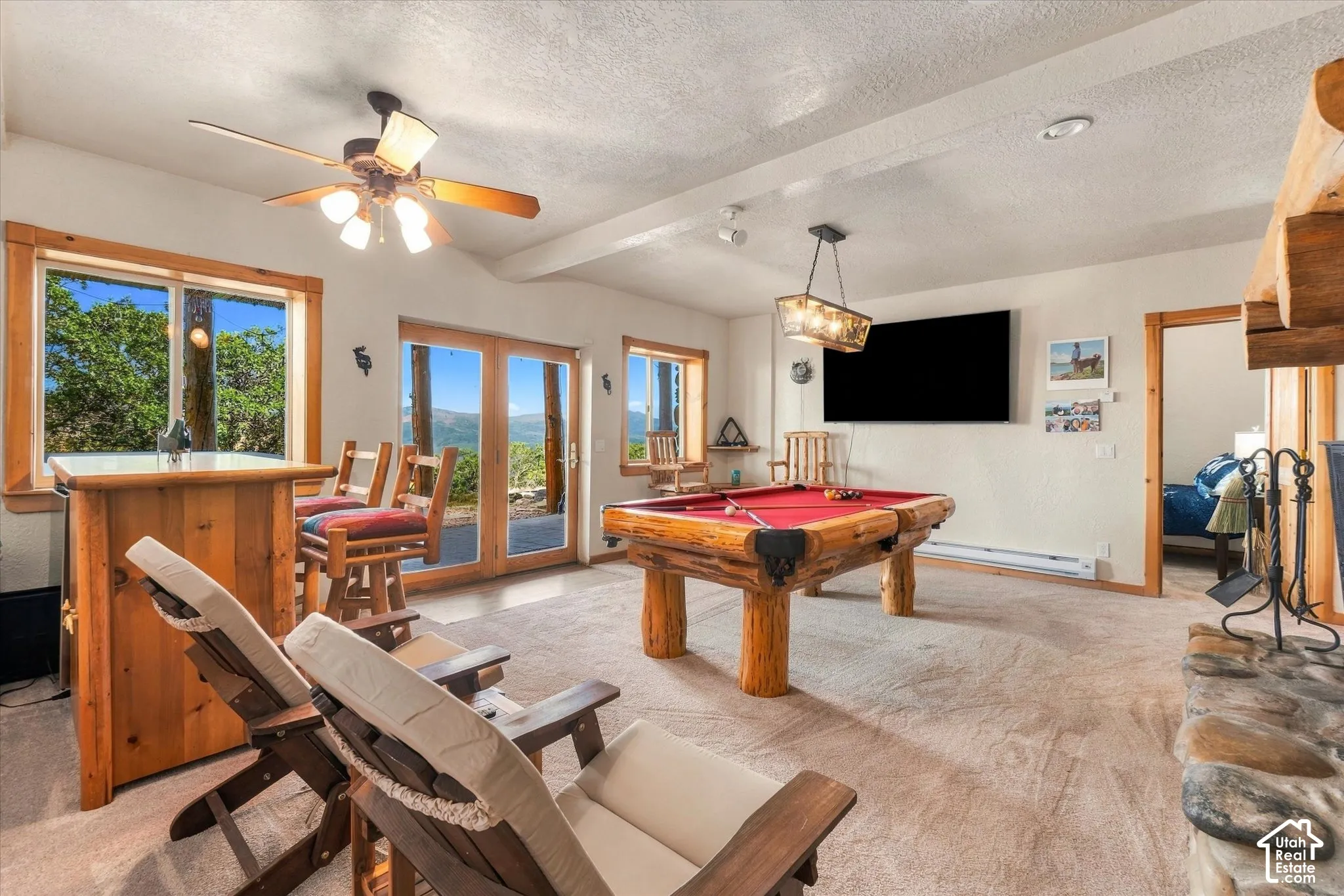 Built-in bar, wood-framed windows, and glass doors with wood frames